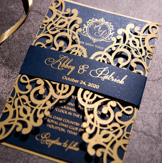 a blue and gold invitation with a ribbon