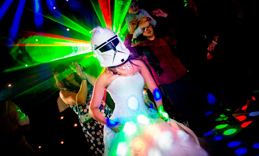 a woman in a white dress and a white helmet with lights coming out of her head